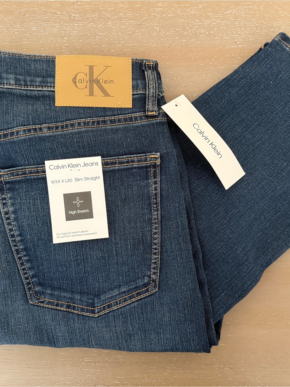 Calvin Klein Dark Blue Slim Straight Jeans with Leather Patch